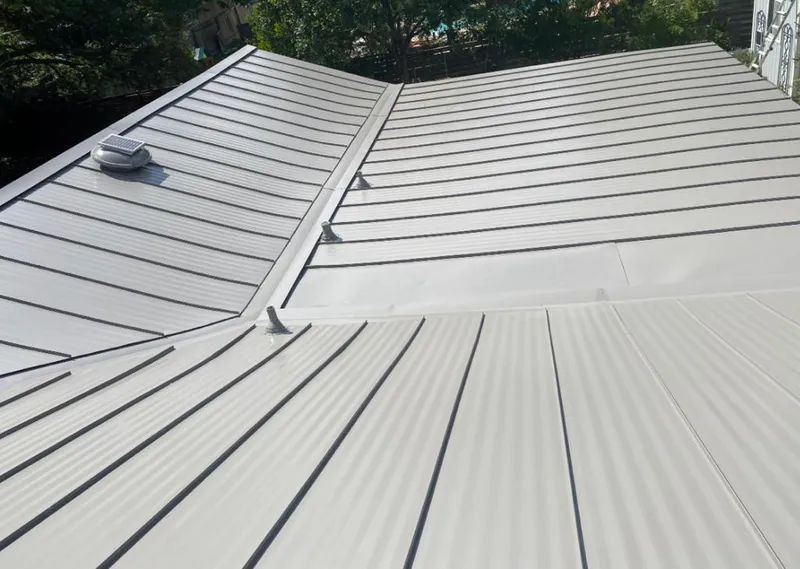 Solar attic fan installed on a metal roof for Roof Ventilation in Wekiwa Springs